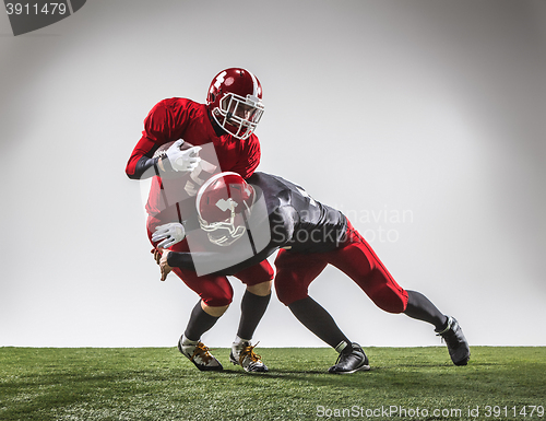 Image of The two american football players in action