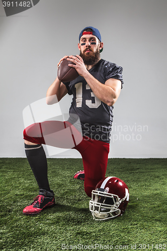 Image of The american football player with ball