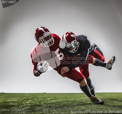 Image of The two american football players in action