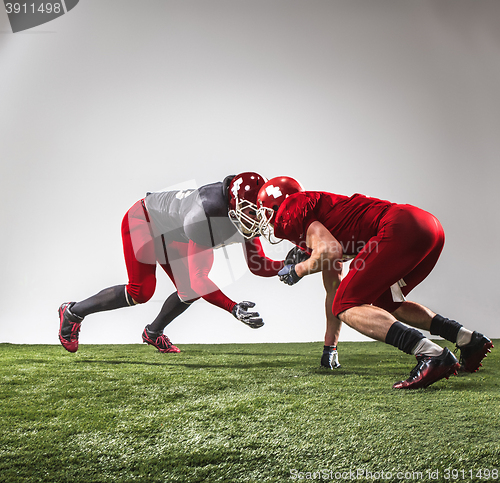 Image of The two american football players in action