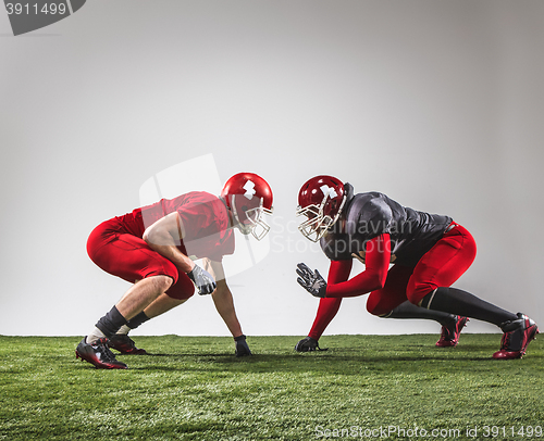 Image of The two american football players in action