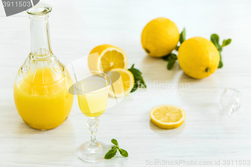 Image of Italian traditional liqueur limoncello with lemon