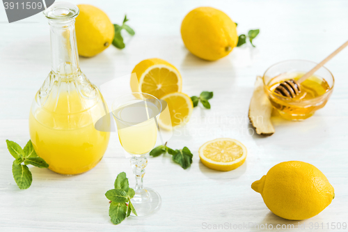 Image of Italian traditional liqueur limoncello with lemon