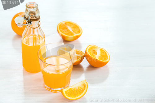 Image of Glass of orange liqueur. Selective focus
