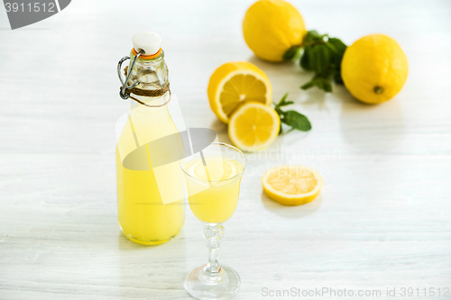 Image of Italian traditional liqueur limoncello with lemon