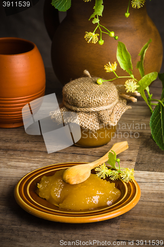 Image of Saucer with lime honey on the table,\rclose-up