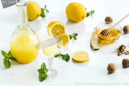 Image of Italian traditional liqueur limoncello with lemon