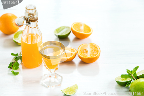 Image of Glass of orange liqueur. Selective focus