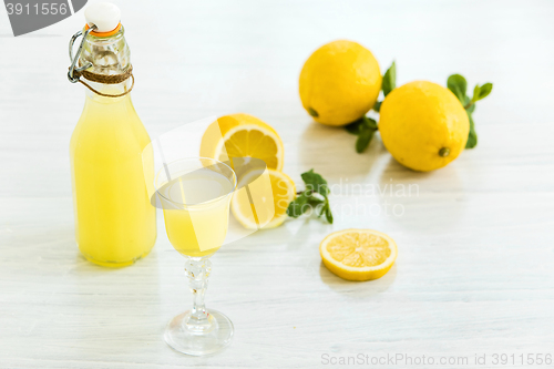 Image of Italian traditional liqueur limoncello with lemon