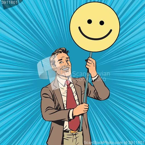 Image of Protester with a poster Emoji smiley