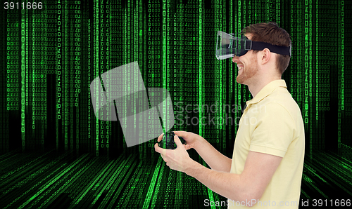 Image of happy man in virtual reality headset with gamepad