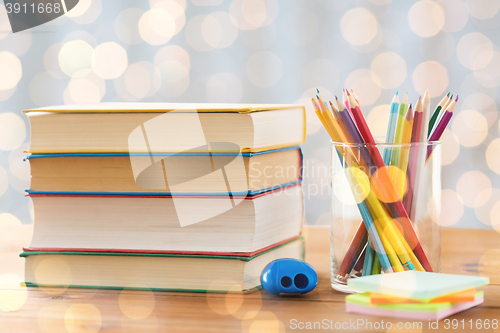 Image of close up of crayons or color pencils and books