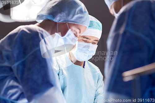 Image of group of surgeons in operating room at hospital