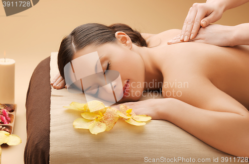 Image of beautiful woman in massage salon