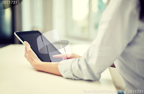 Image of close up of woman hands with tablet pc at office
