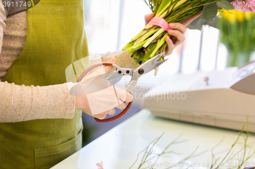 Image of close up of florist making bunch at flower shop