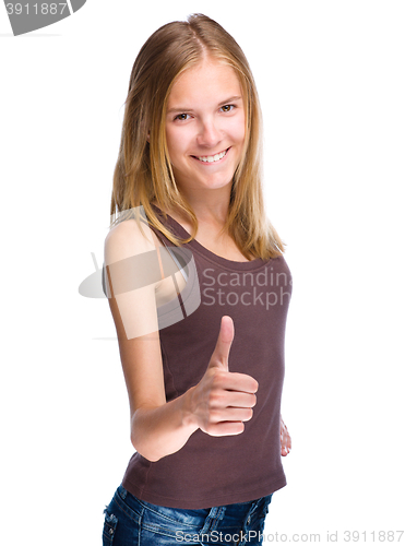 Image of Woman is showing thumb up gesture