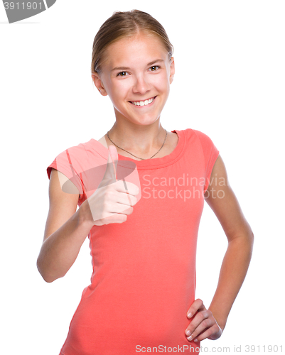 Image of Young girl is showing thumb up gesture