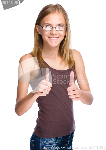 Image of Woman is showing thumb up gesture