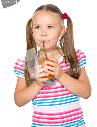 Image of Little girl is drinking carrot juice