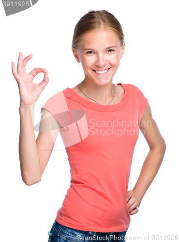 Image of Young teen girl is showing OK sign