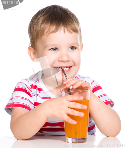 Image of Little boy with glass of carrot juice