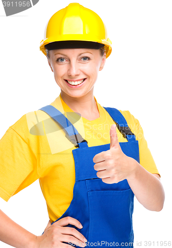 Image of Young construction worker is showing thumb up sign