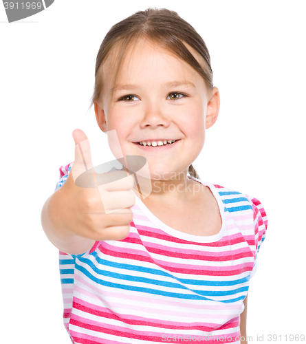 Image of Little girl is showing thumb up gesture