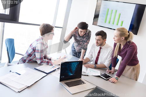 Image of young business people group on meeting at modern office