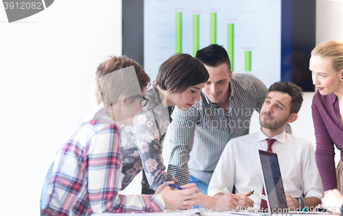 Image of young business people group on meeting at modern office