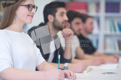 Image of group of students study together in classroom