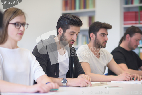 Image of group of students study together in classroom