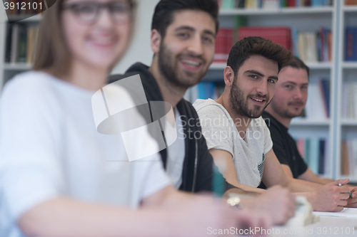 Image of group of students study together in classroom