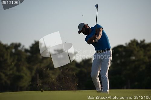 Image of golfer hitting long shot