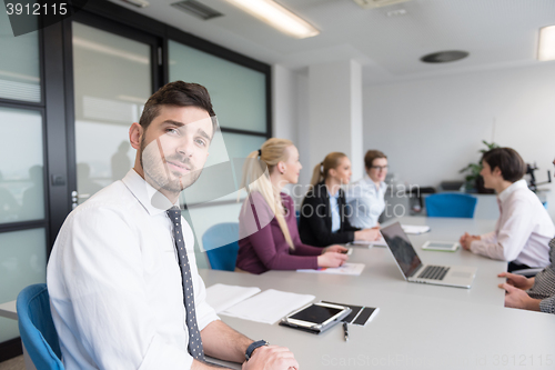 Image of young business people group on team meeting at modern office