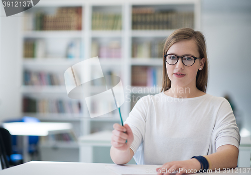 Image of female student study in school library