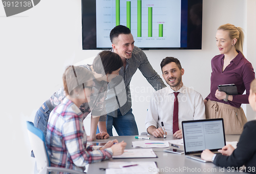 Image of young business people group on meeting at modern office