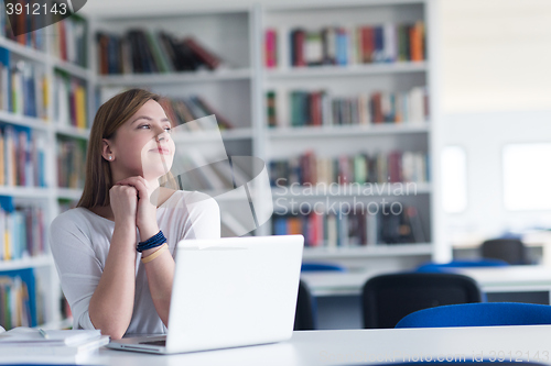 Image of female student study in school library