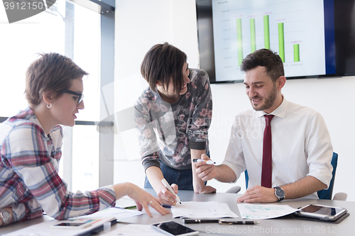 Image of young business people group on meeting at modern office