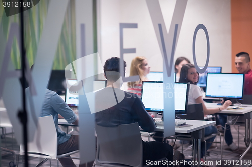 Image of technology students group working  in computer lab school  class