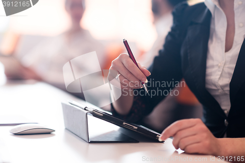 Image of woman hands holding pen on business meeting