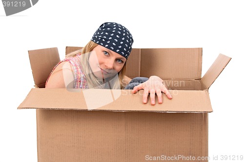 Image of Girl hiding in a cardboard box