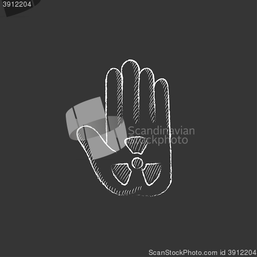 Image of Ionizing radiation sign on a palm. Drawn in chalk icon.