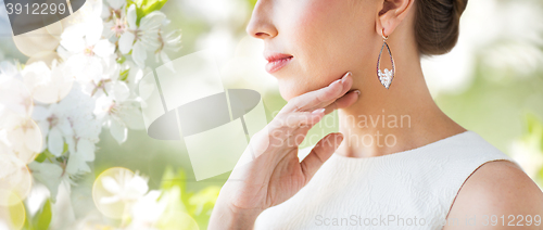 Image of close up of beautiful woman face with earring