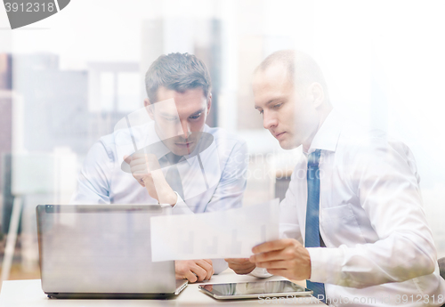 Image of two businessmen having discussion in office