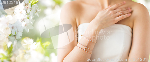 Image of close up of beautiful woman with ring and bracelet