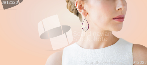 Image of close up of beautiful woman face with earring