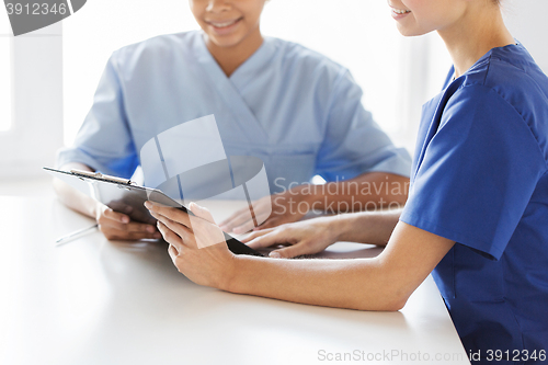 Image of close up of doctors with clipboard at hospital