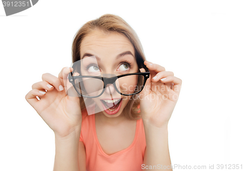 Image of happy young woman or teenage girl in eyeglasses