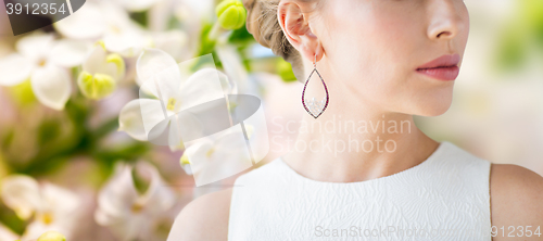 Image of close up of beautiful woman face with earring